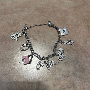 James Avery Silver Charm Bracelet with 8 charms and one Pink purse Accents